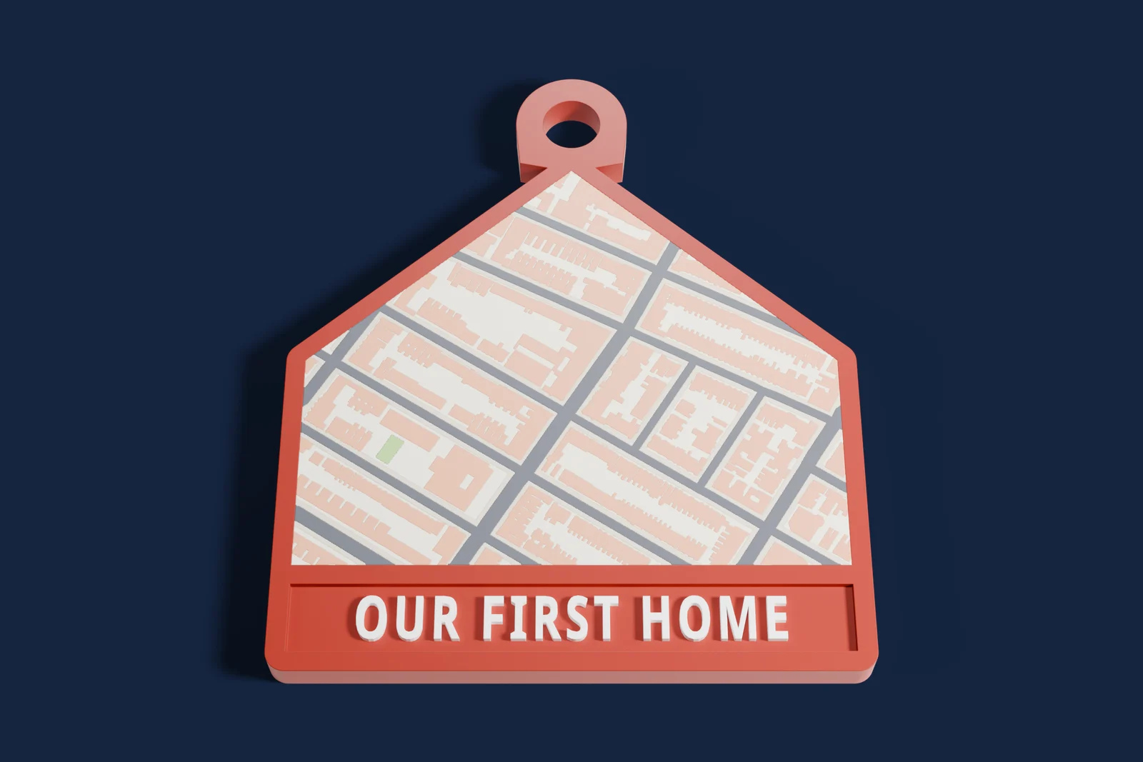 House-shaped 3D map keychain of Park Slope, Brooklyn, that reads Our first home