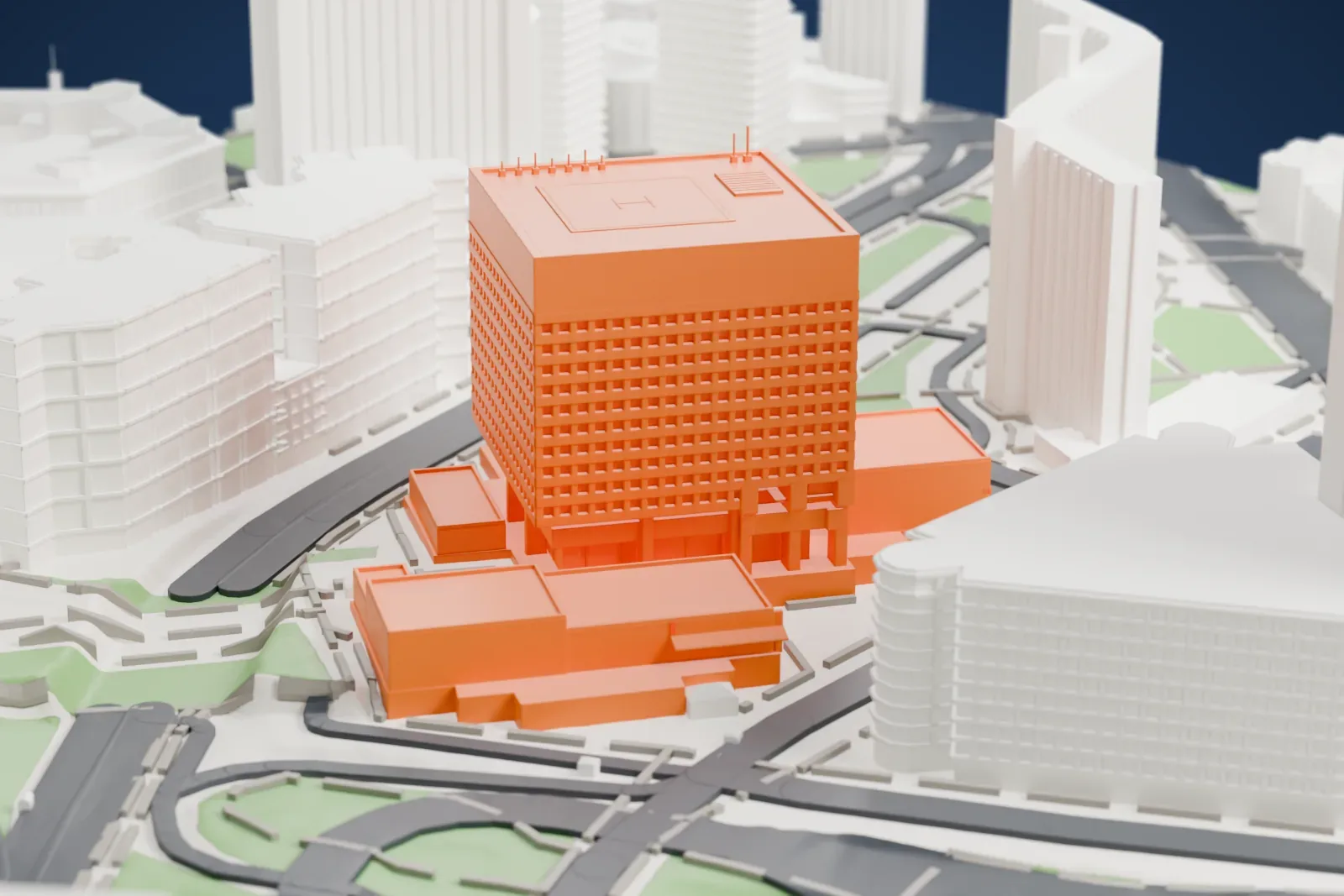 A white 3D print of 1 Police Plaza, a square tower with a flat roof on a stepped base, surrounded by tall buildings, a viaduct, roads and green patches.