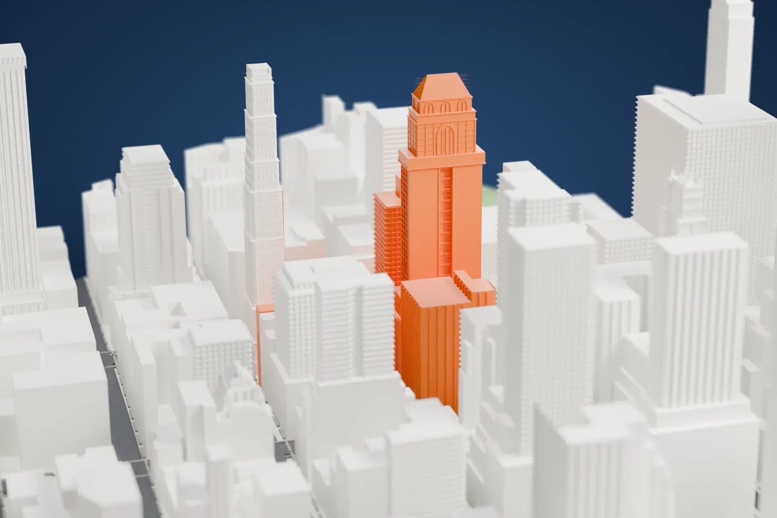 A white 3D print of 10 East 40th Street, a tall tower with a pyramid-shaped roof over an arched crown, standing among dense Midtown skyscrapers.