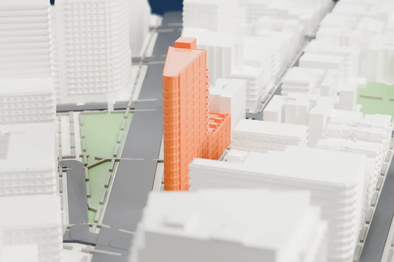 A white 3D print of 10 Sullivan, a tall wedge-shaped residential building with stepped rounded terraces on one side and a lower wing, among buildings, streets and small parks.