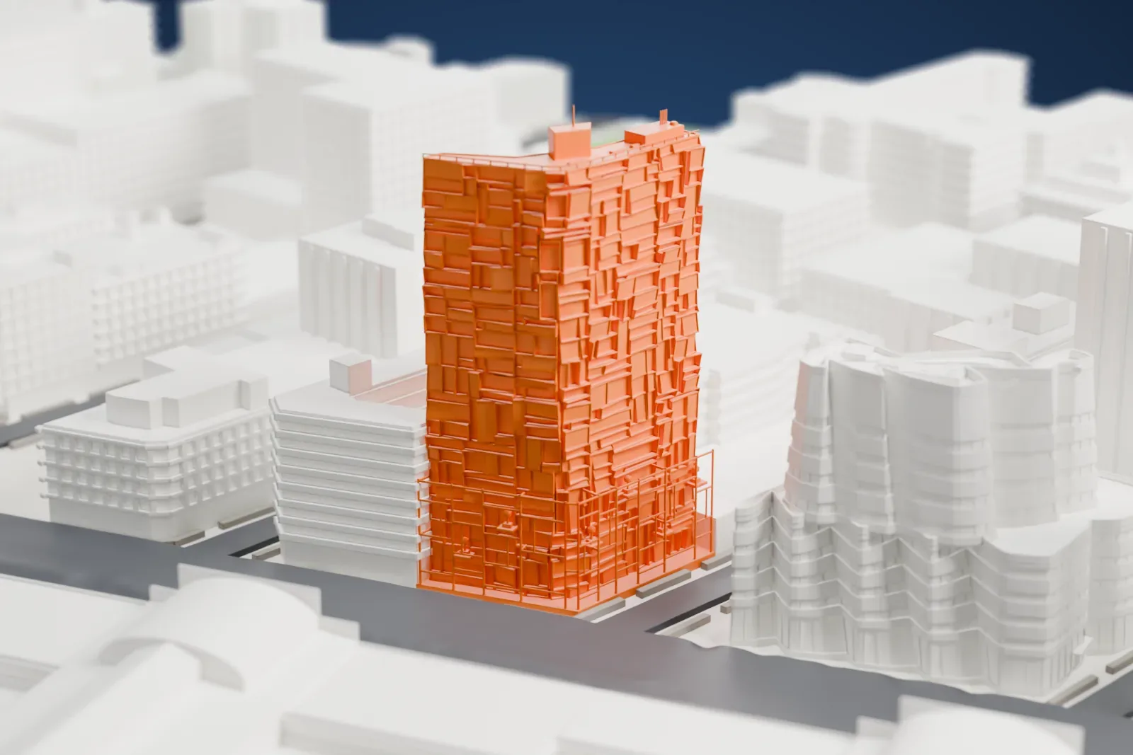 A white 3D print of 100 Eleventh Avenue, a tall tower with a faceted, uneven facade, standing near the water with a wide road beside it.
