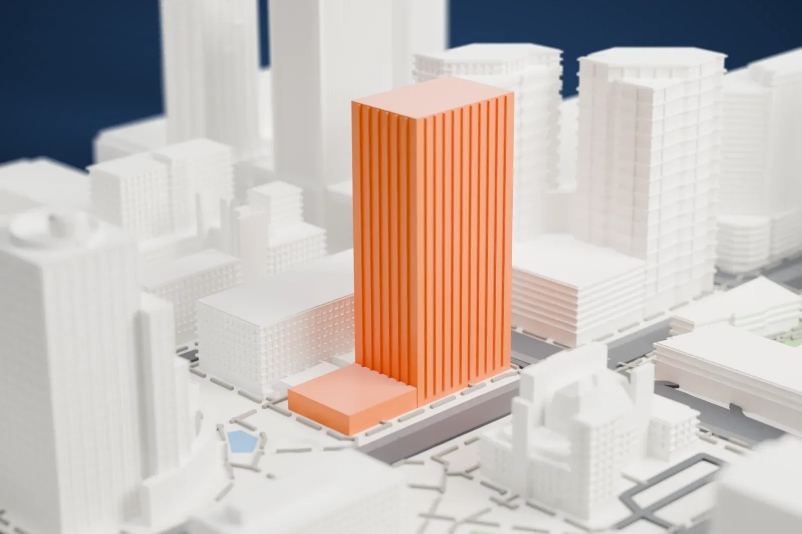 A white 3D print of 100 West Washington, a tall slab tower with rows of window ledges, standing among other downtown buildings and wide streets.