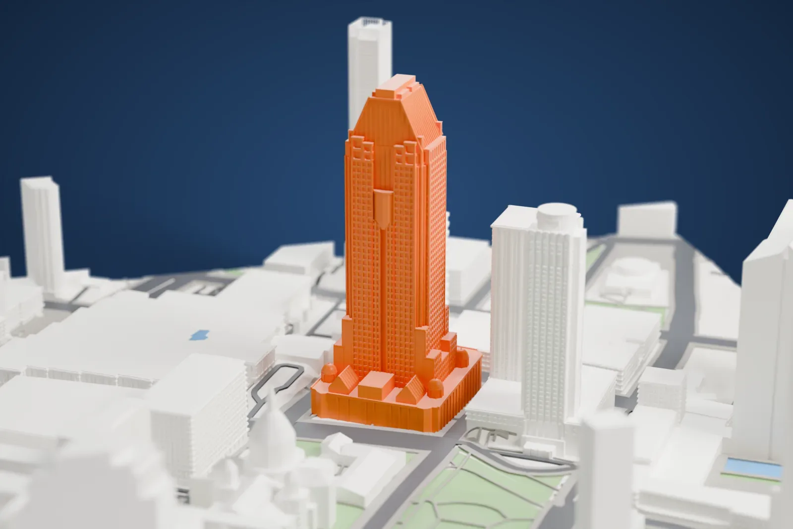 A white 3D print of 1000 de La Gauchetière among the surrounding streets and buildings.