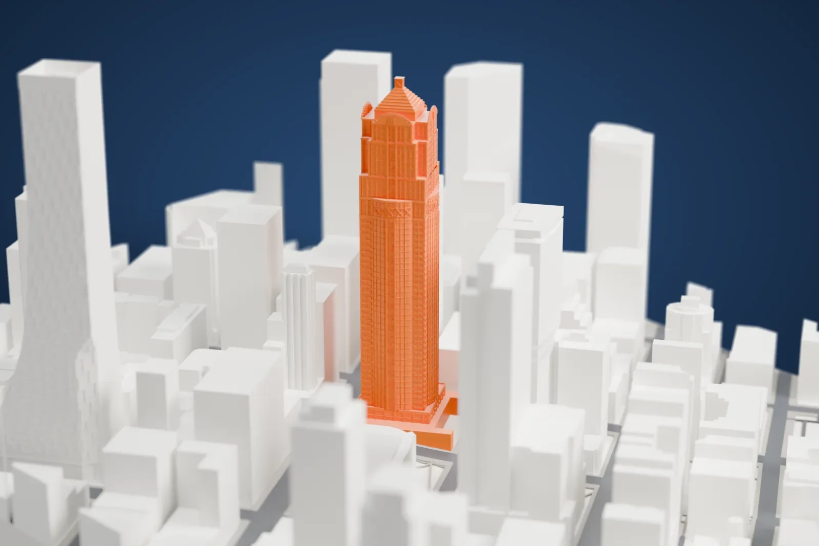 A white 3D print of 1201 Third Avenue, a tall office tower, rising above the surrounding streets and buildings of Seattle.