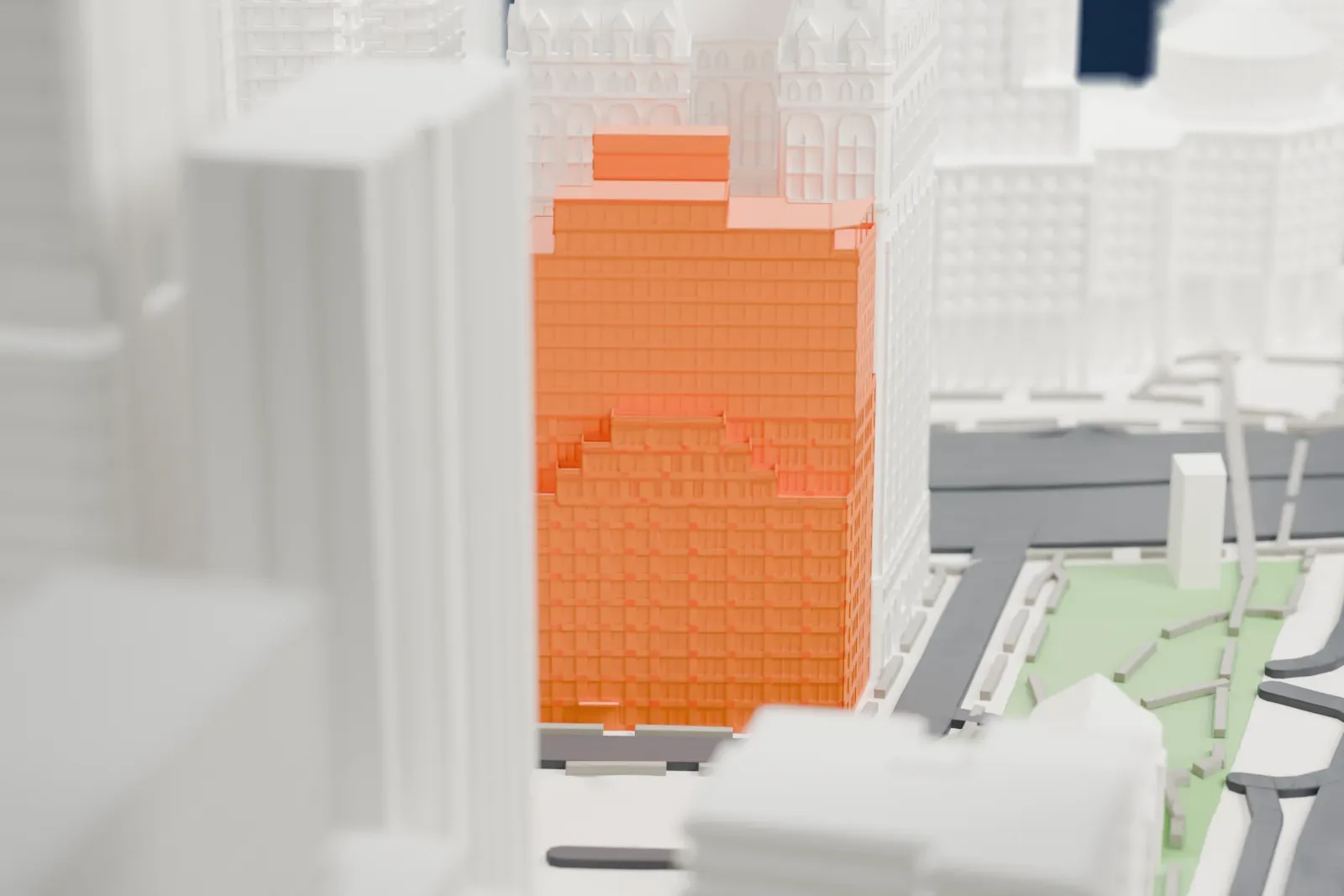 A white 3D print of 130 Cedar Street, a tall stepped block standing beside a larger tower with a decorated crown, among dense streets in Lower Manhattan.
