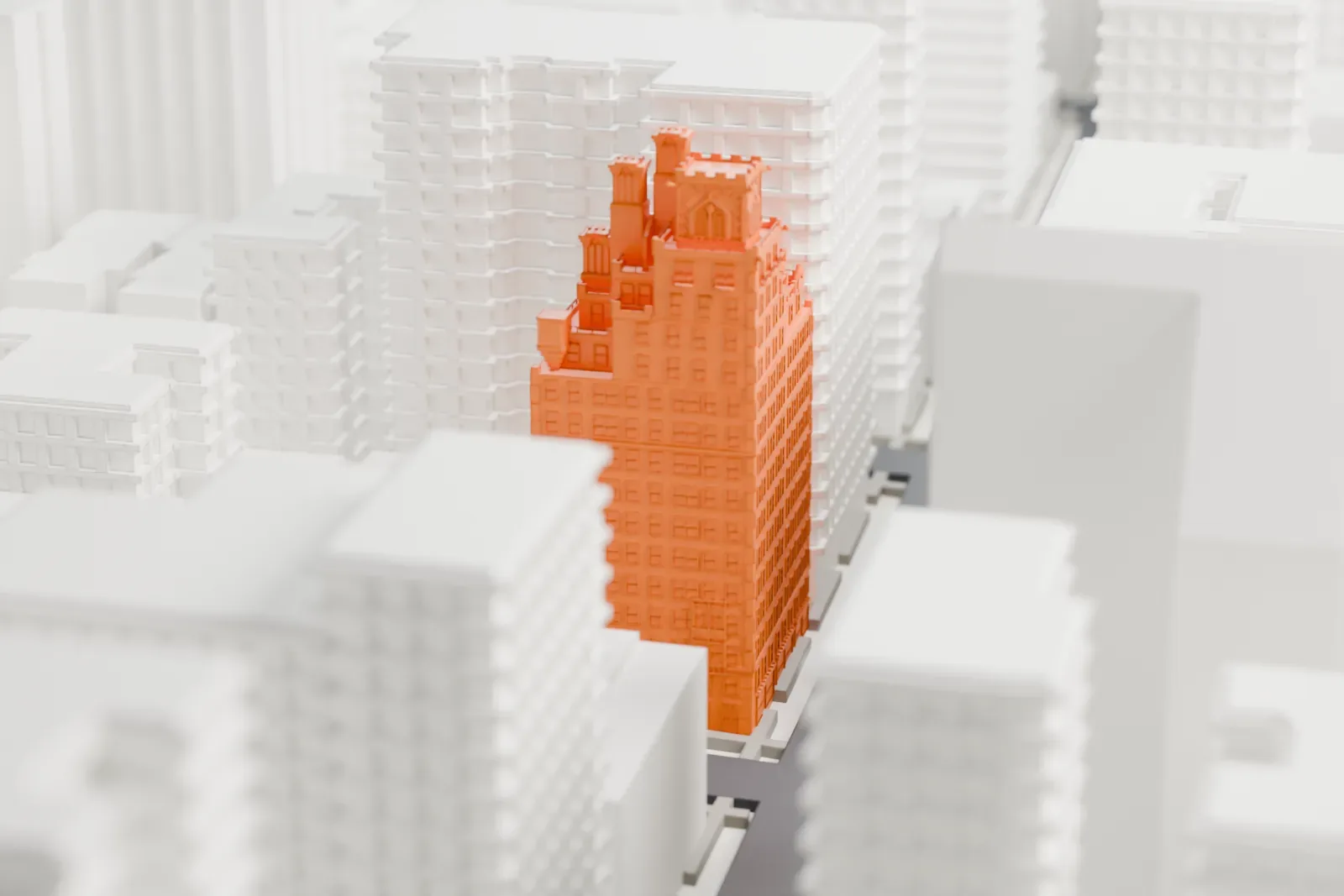 A white 3D print of 133 East 80th Street, a tall brick building with a crenellated, castle-like top, standing among closely packed taller and lower buildings.