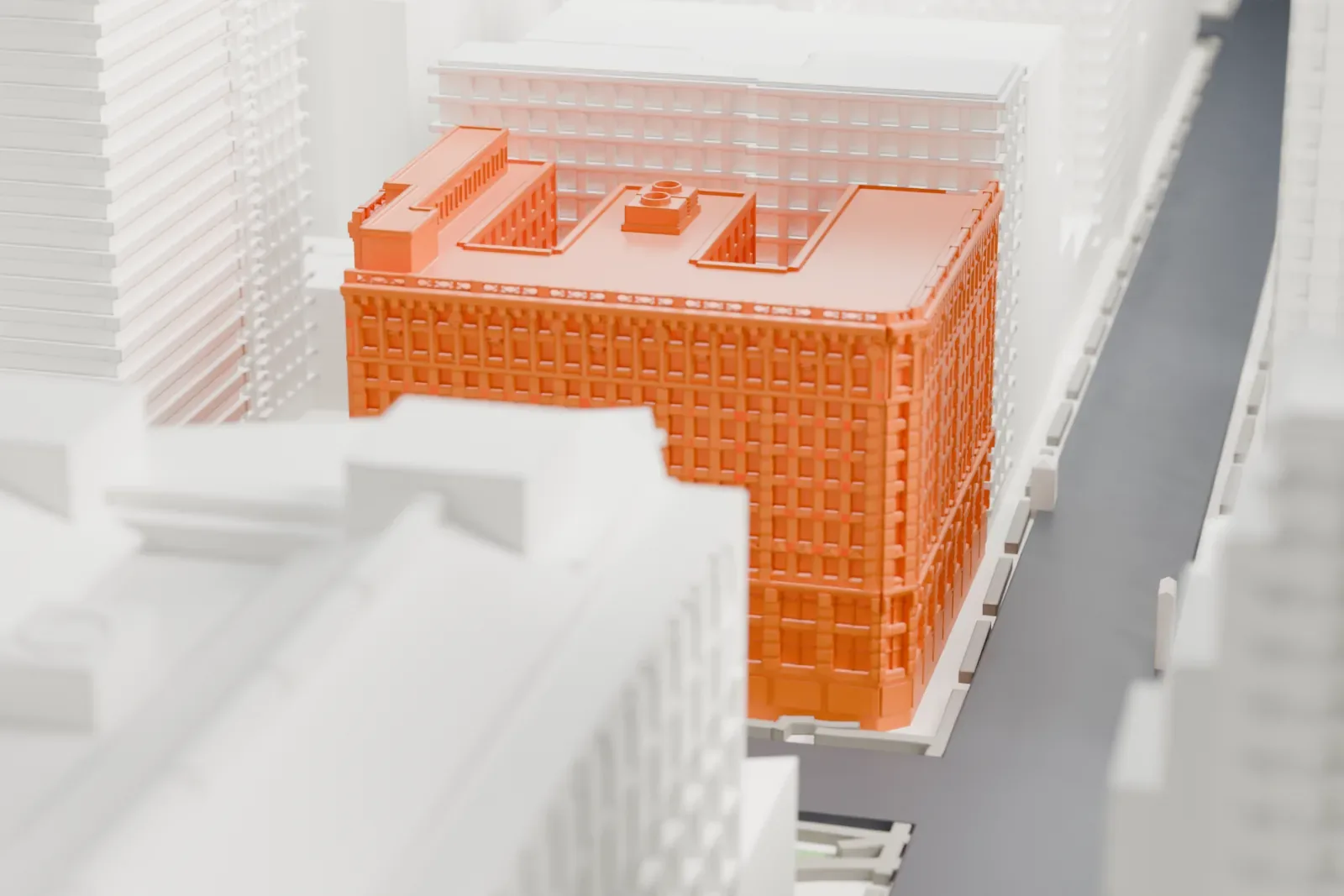 A white 3D print of 2 Herald Square, a tall building with an ornate facade and a notched roof plan, standing among taller buildings and streets.