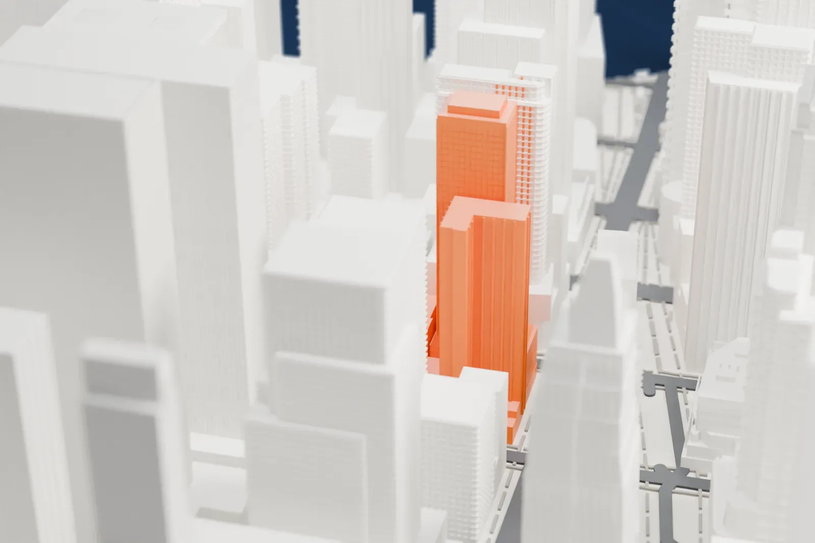 A white 3D print of 20 Times Square, a boxy tower with a stepped crown, packed in among many other tall buildings.