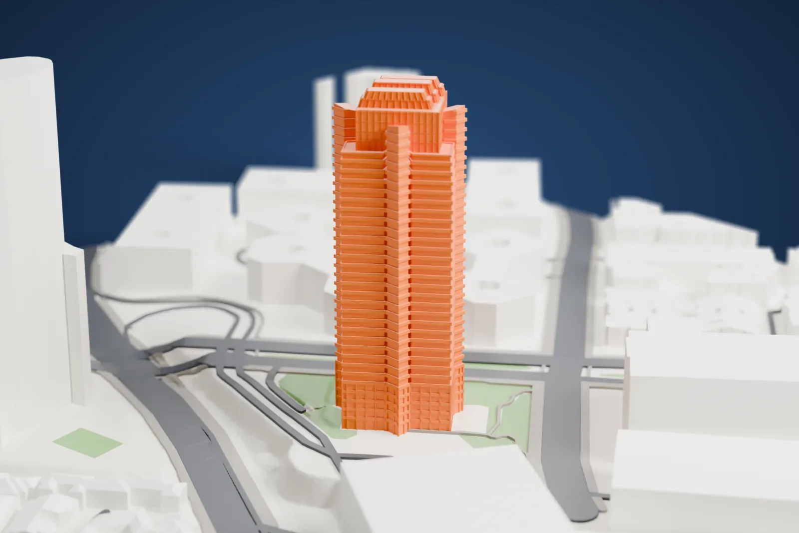 A white 3D print of 2121 Avenue of the Stars, a tall tower on its Century City block among surrounding streets and buildings.