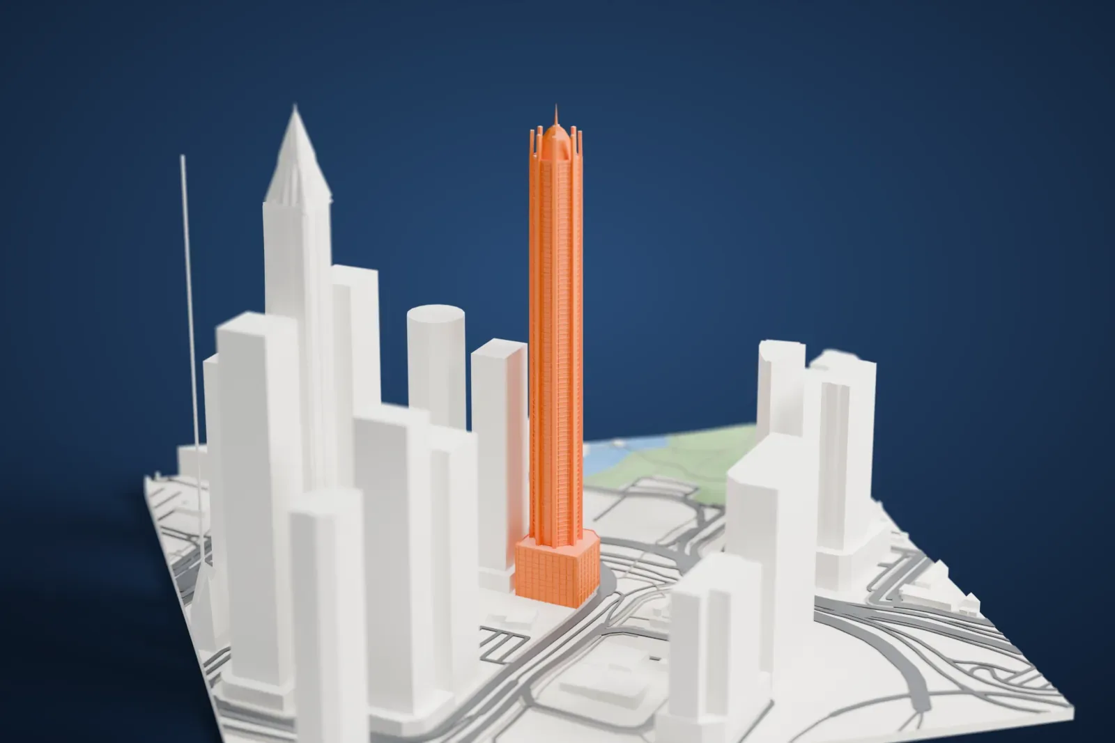 A white 3D print of 23 Marina, a tall residential tower rising among the surrounding city buildings.