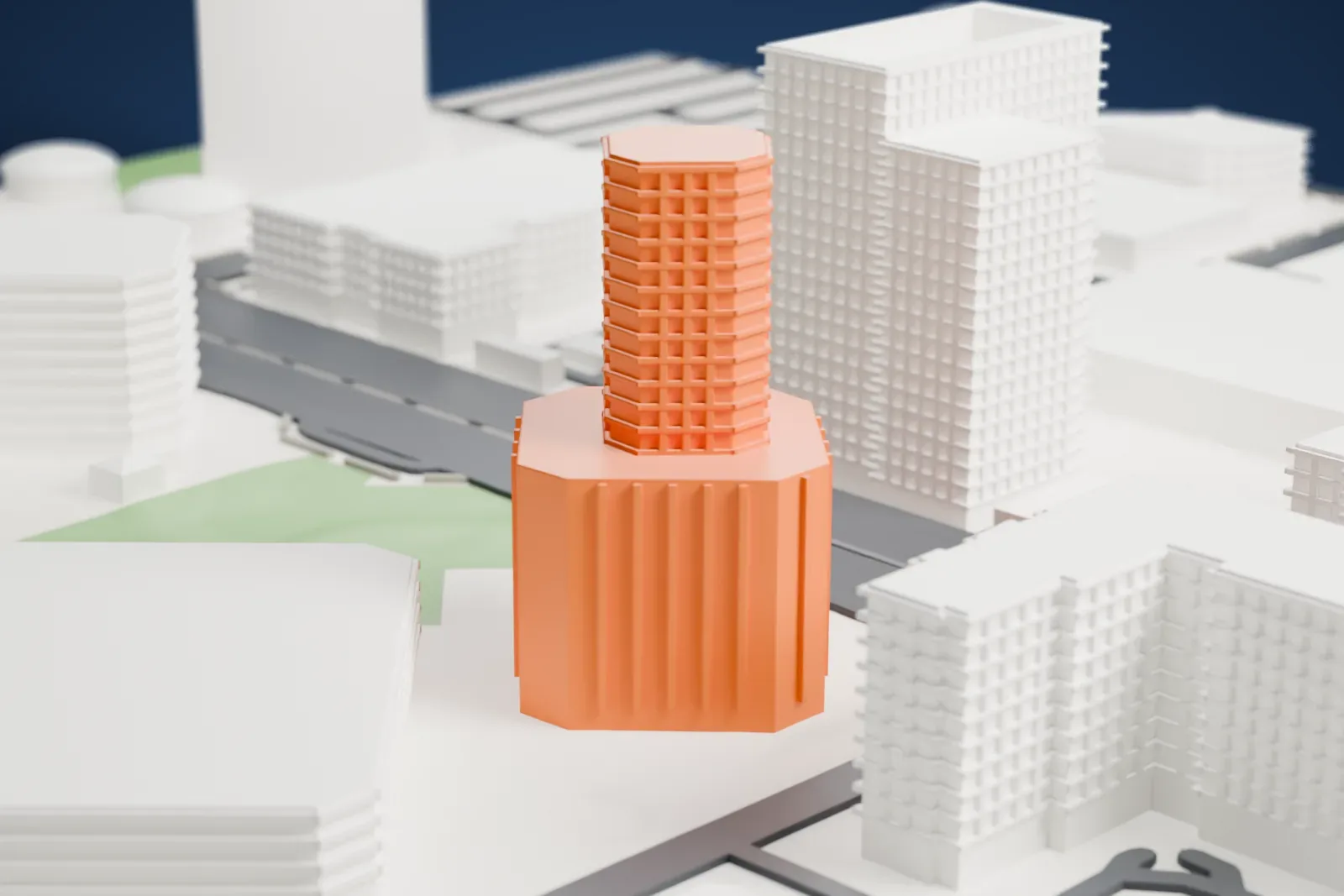 A white 3D print of 3200 Central, a tall eight-sided tower with vertical ribs and a railed balcony at the top, standing beside roads and low buildings.