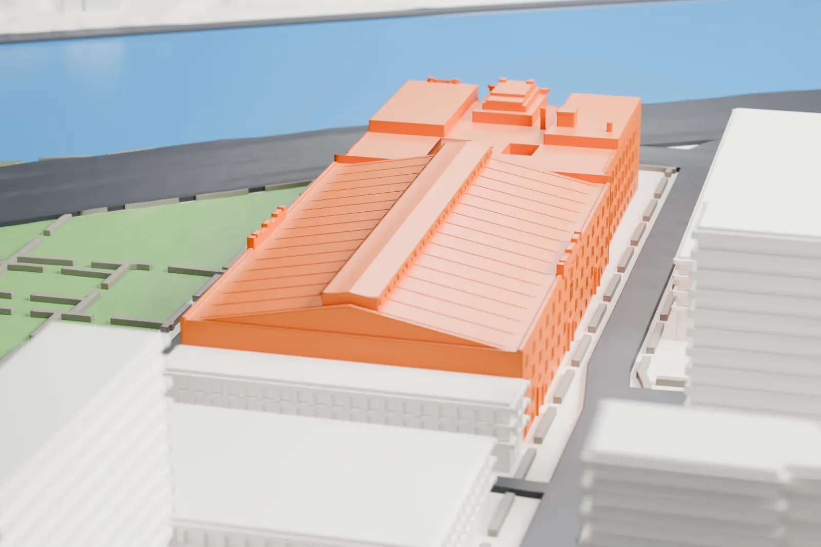 A white 3D print of the 369th Regiment Armory, a long block with a ribbed pitched roof and a taller building at one end, beside a park and a river.