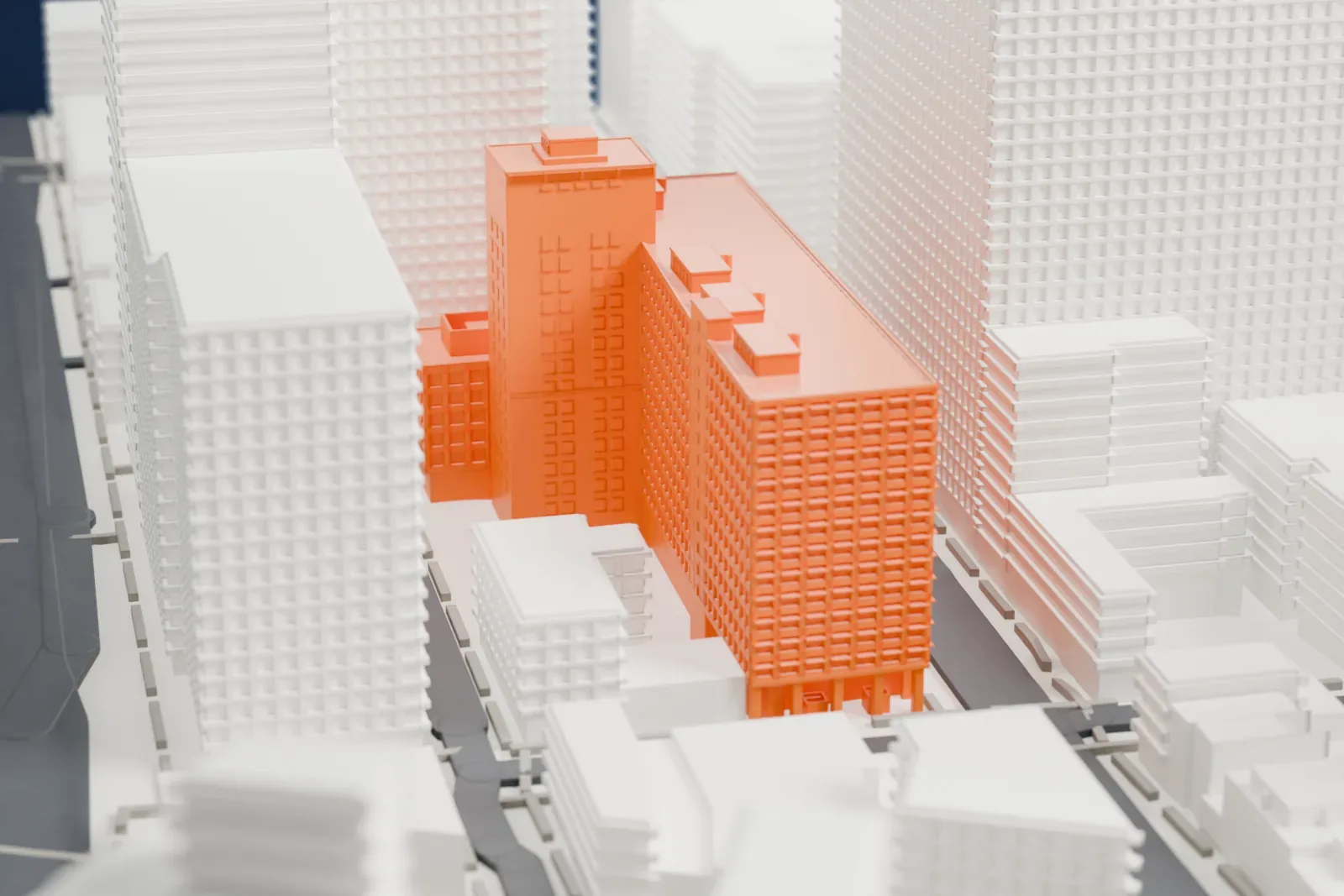 A white 3D print of 370 Jay Street, a tall block with a regular grid of windows, among taller buildings and narrow streets.