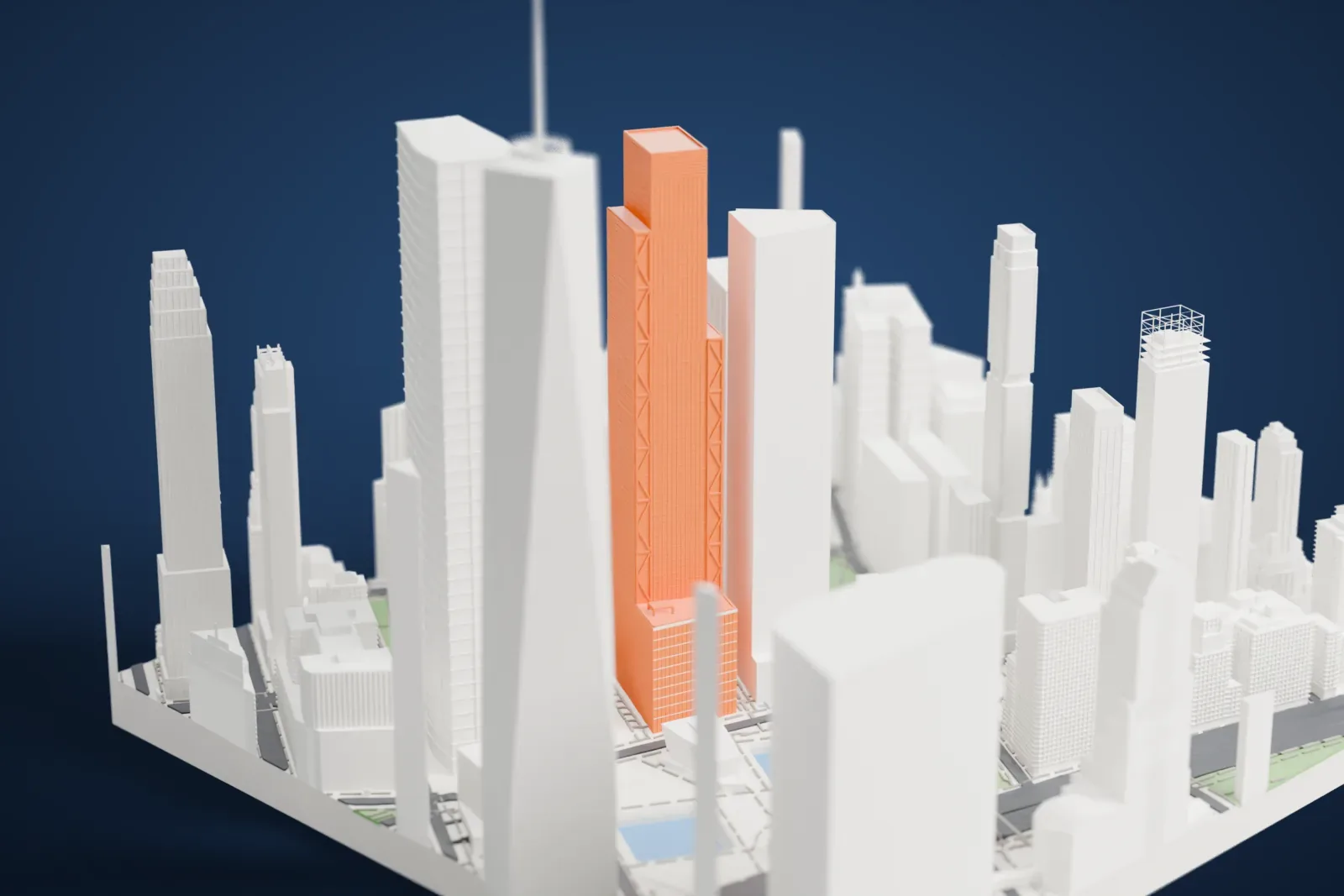A white 3D print of 4 World Trade Center, a tall slab tower with a slanted top, standing among taller and shorter buildings beside open plaza ground with blue water.