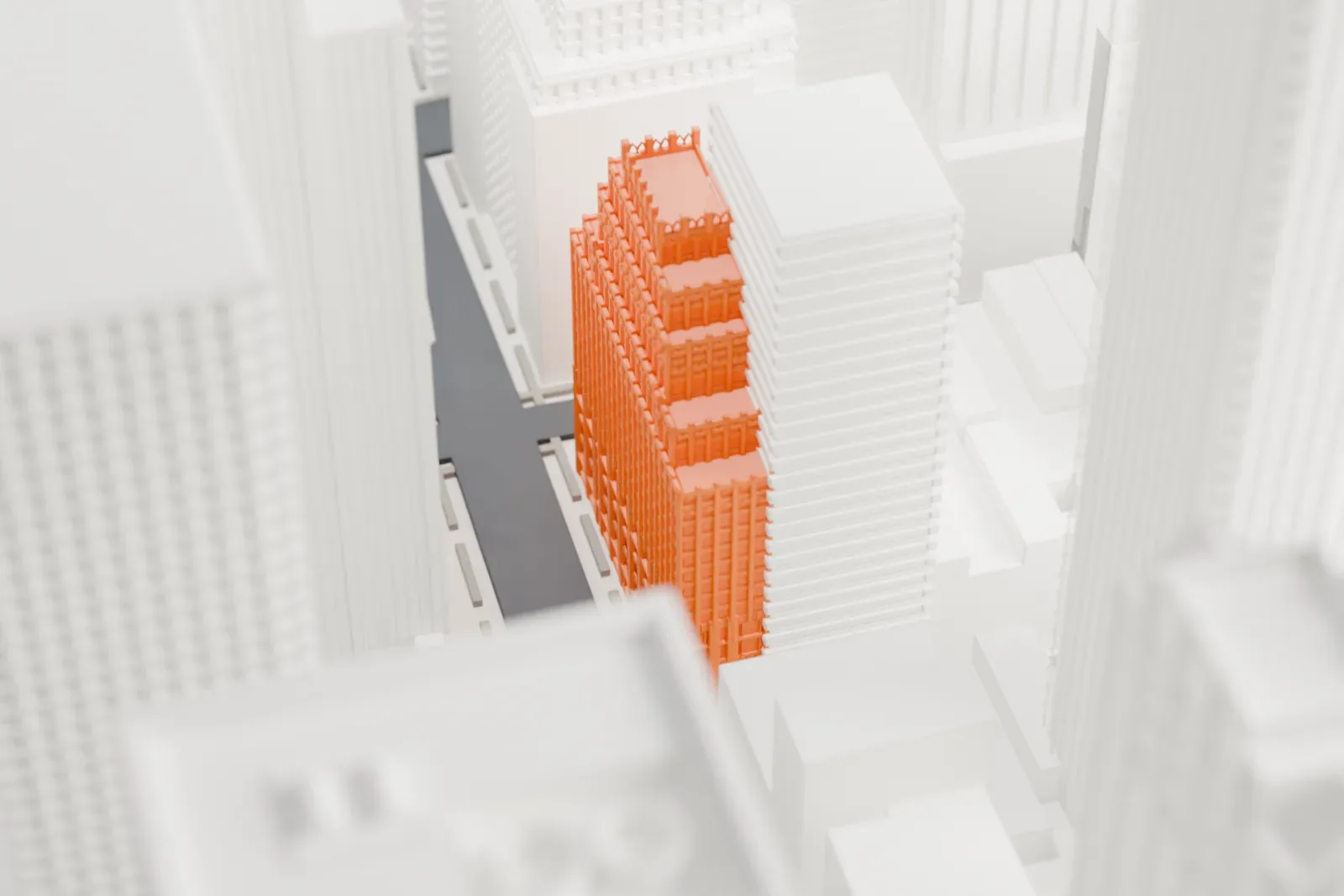 A white 3D print of 400 Madison Avenue, a slender building set among taller towers in surrounding Midtown blocks.