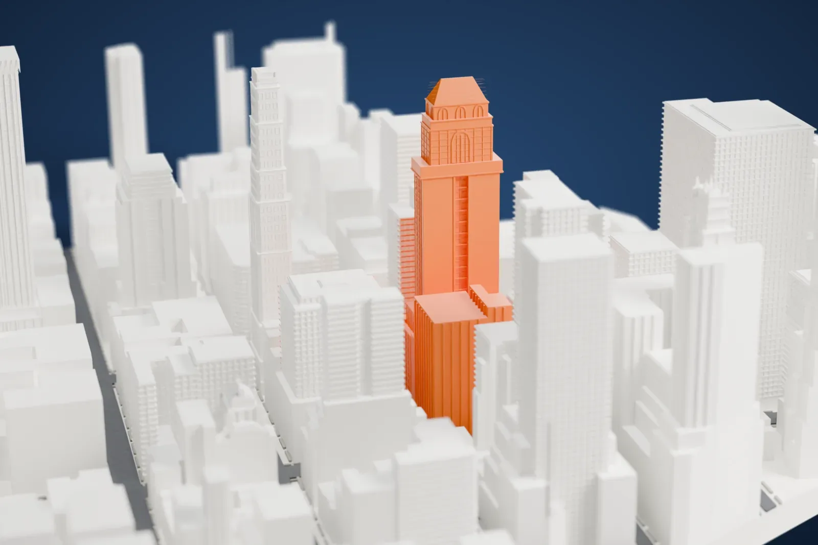 A white 3D print of 425 Fifth Avenue, a slim tower with stepped setbacks and a crown of stacked blocks, standing among taller and shorter Midtown buildings.