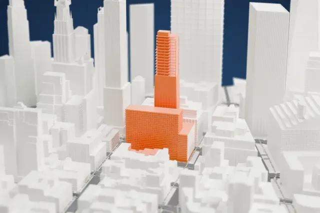 A white 3D print of the 45 Park Place model in New York, with the streets around it.