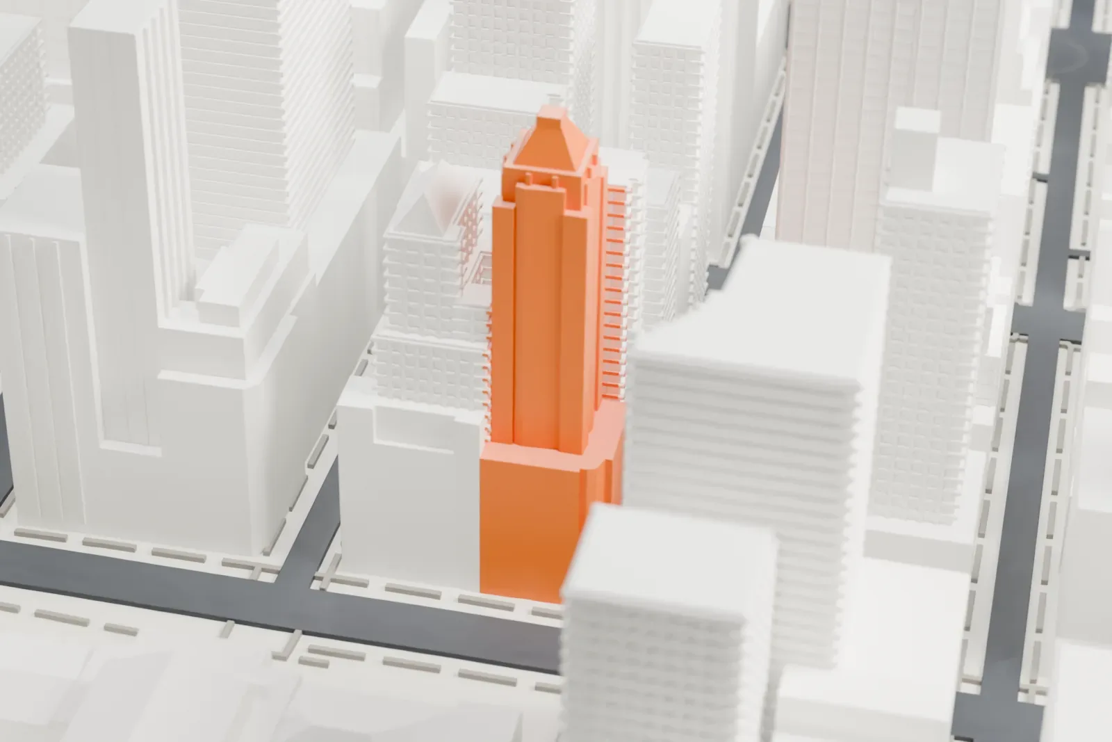 A white 3D print of 461 Fifth Avenue, a slim tower with a pyramid-shaped roof, partly hidden among taller neighboring buildings.