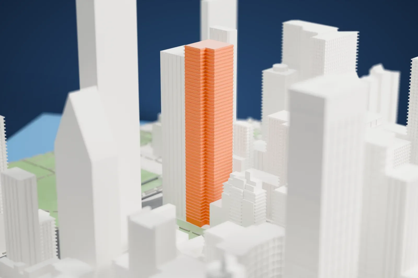 A white 3D print of 50 United Nations Plaza, a slim tall tower with a stepped top, standing among taller and lower Manhattan buildings, with lawns and a road below.
