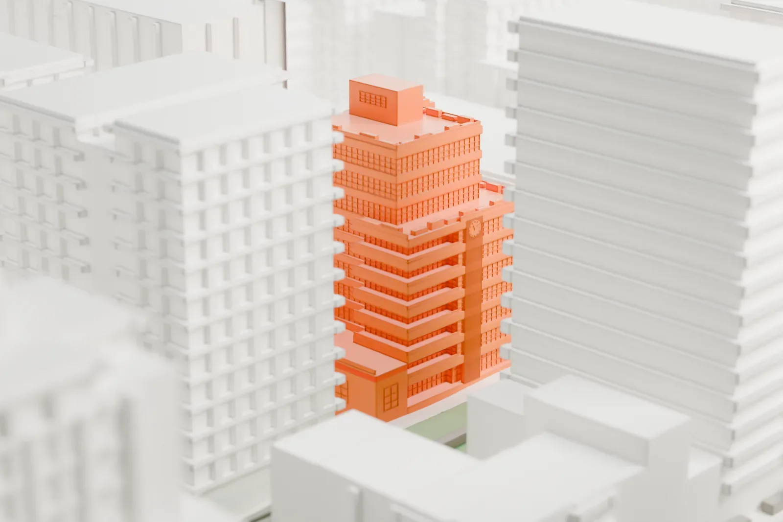 A white 3D print of 508 West 24th Street, a stepped residential building with horizontal bands, set among taller buildings with a small green courtyard beside it.