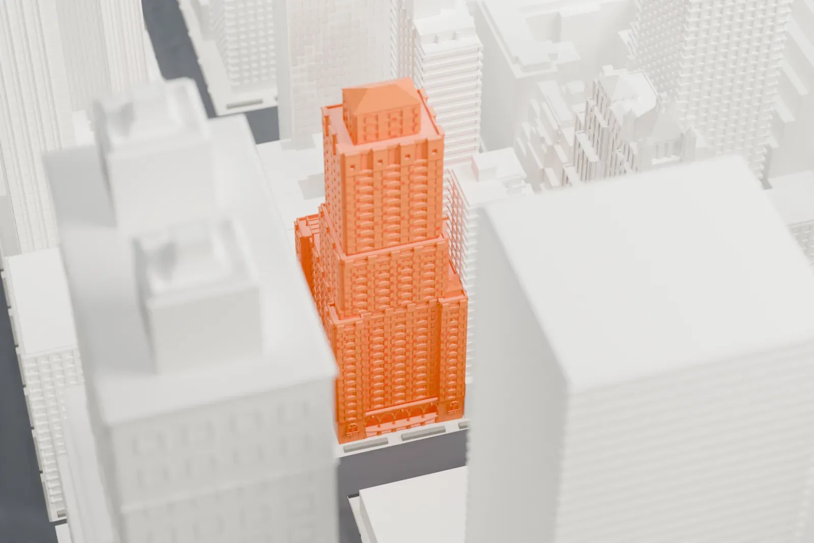 A white 3D print of 525 Lexington Avenue, a tall stepped tower, standing among other high-rises.