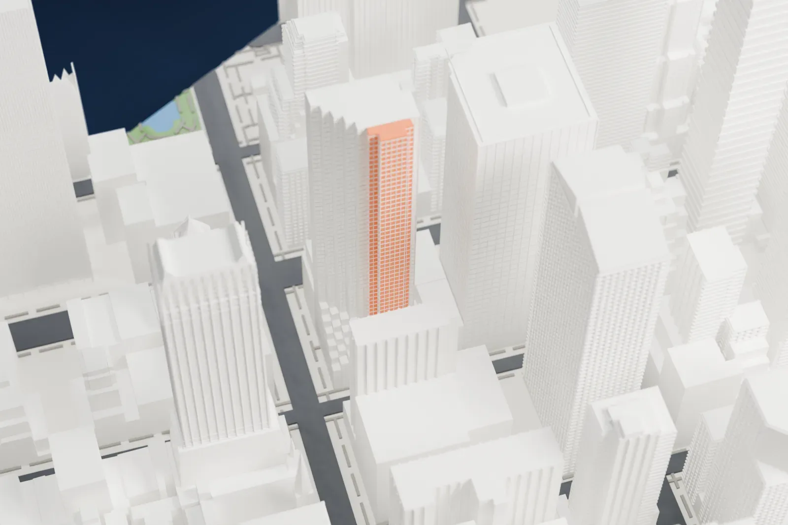 A white 3D print of 550 Madison Avenue, a tower with a peaked, notched roof, standing among taller Midtown buildings.