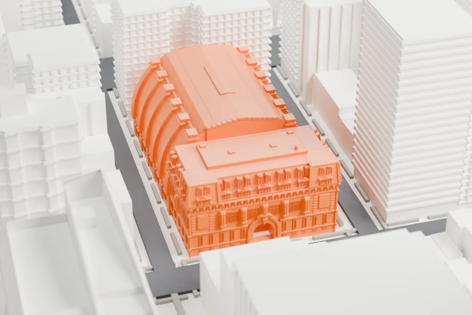 A white 3D print of the 69th Regiment Armory, a long low building with a barrel-roofed shed and a mansard-roofed front, squeezed between taller city blocks.