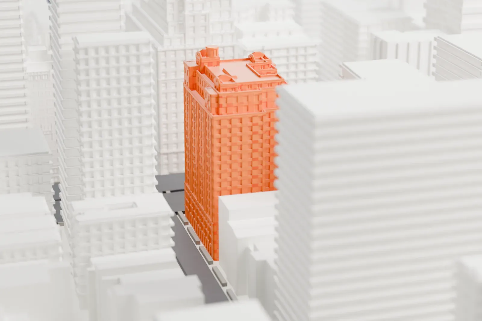 A white 3D print of 737 Park Avenue, a tall stepped apartment building with small roof structures, rising among similar tall buildings.