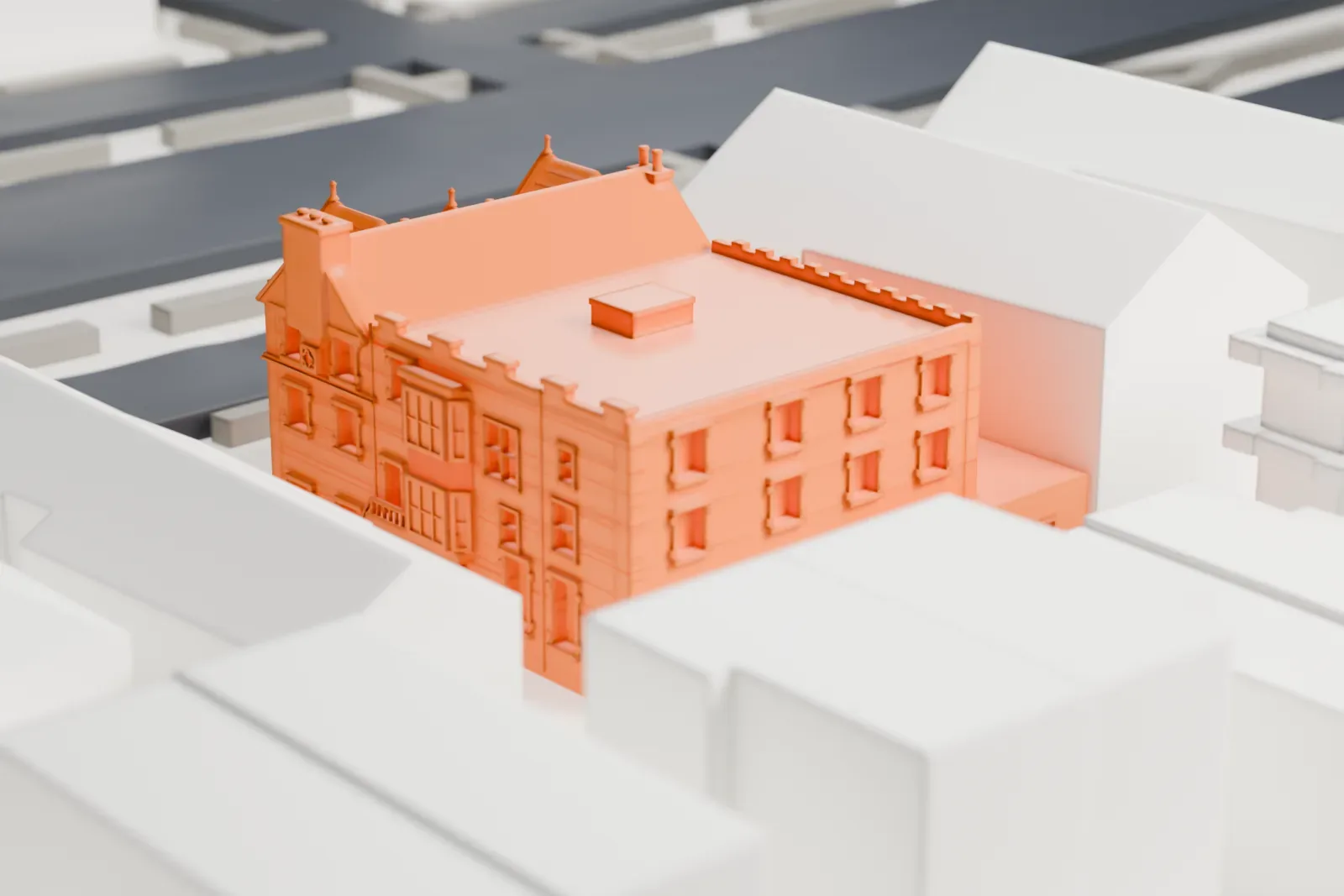 A white 3D print of 770 Eastern Parkway, a building with three front gables and a long flat-roofed wing, among taller and lower neighboring buildings.