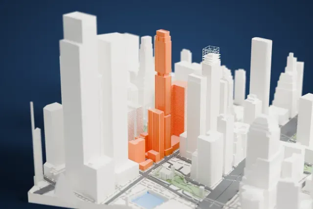 A white 3D print of the 8 Carlisle Street model in New York, with the streets around it.