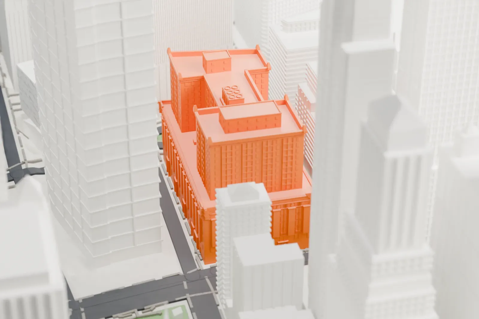 A white 3D print of 90 Church Street, a block-sized building with stepped roof sections, surrounded by much taller towers in Lower Manhattan.