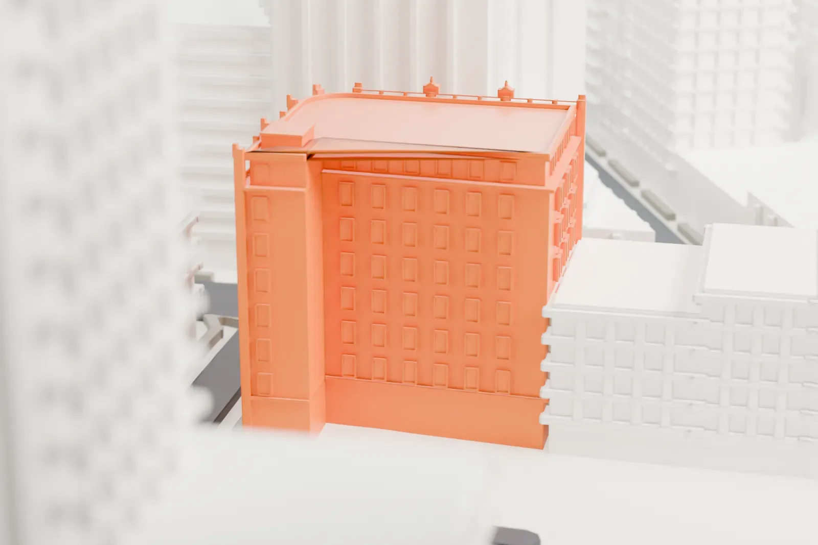 A white 3D print of the A. I. Namm & Son Department Store, an eight-story corner building with a curved corner and ornamental roofline, beside a taller building.