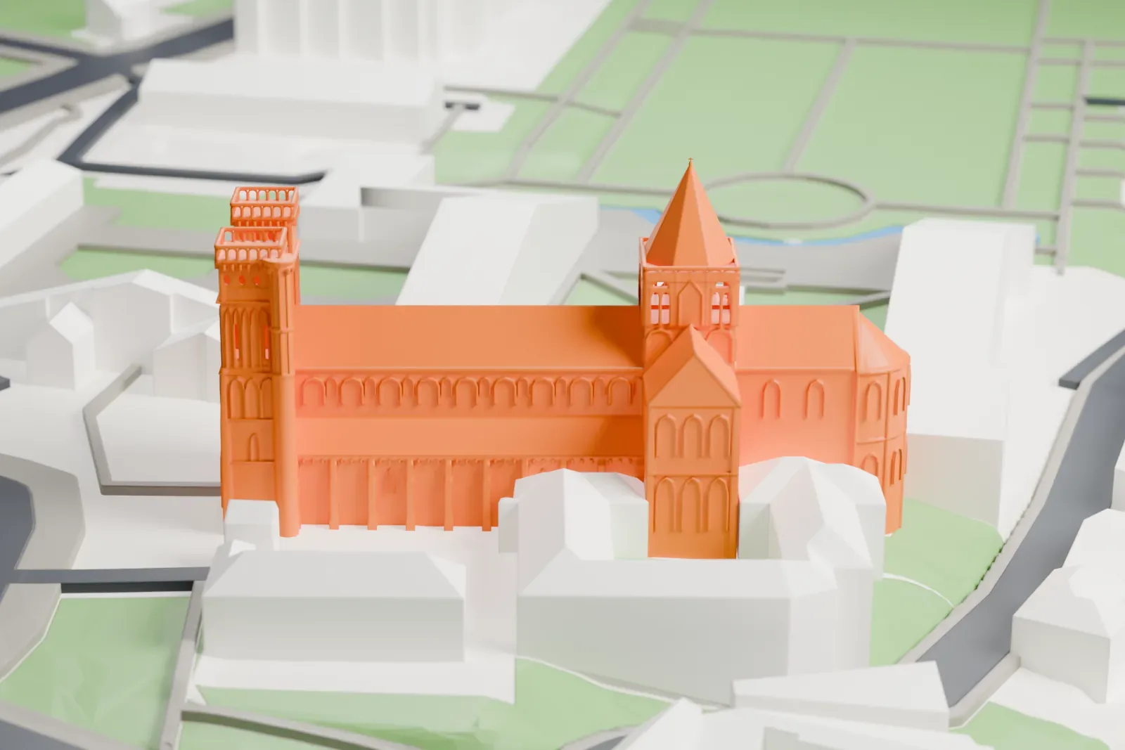 A white 3D print of the Abbey of Sainte-Trinité, with its twin west towers, crossing lantern and rounded apse, set among the surrounding city.