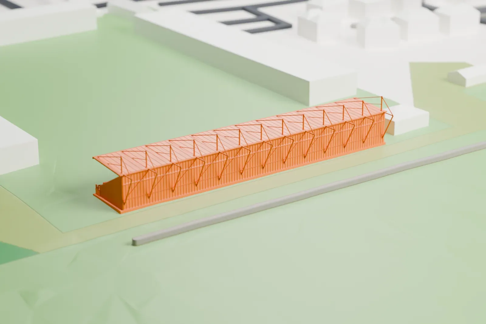 A white 3D print of the Abbey Stadium South Stand, an open single-tier stand with a shallow canopy and roof masts, among surrounding streets and buildings.