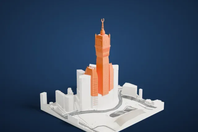 A white 3D print of the Abraj Al Bait model in Mecca, with the streets around it.