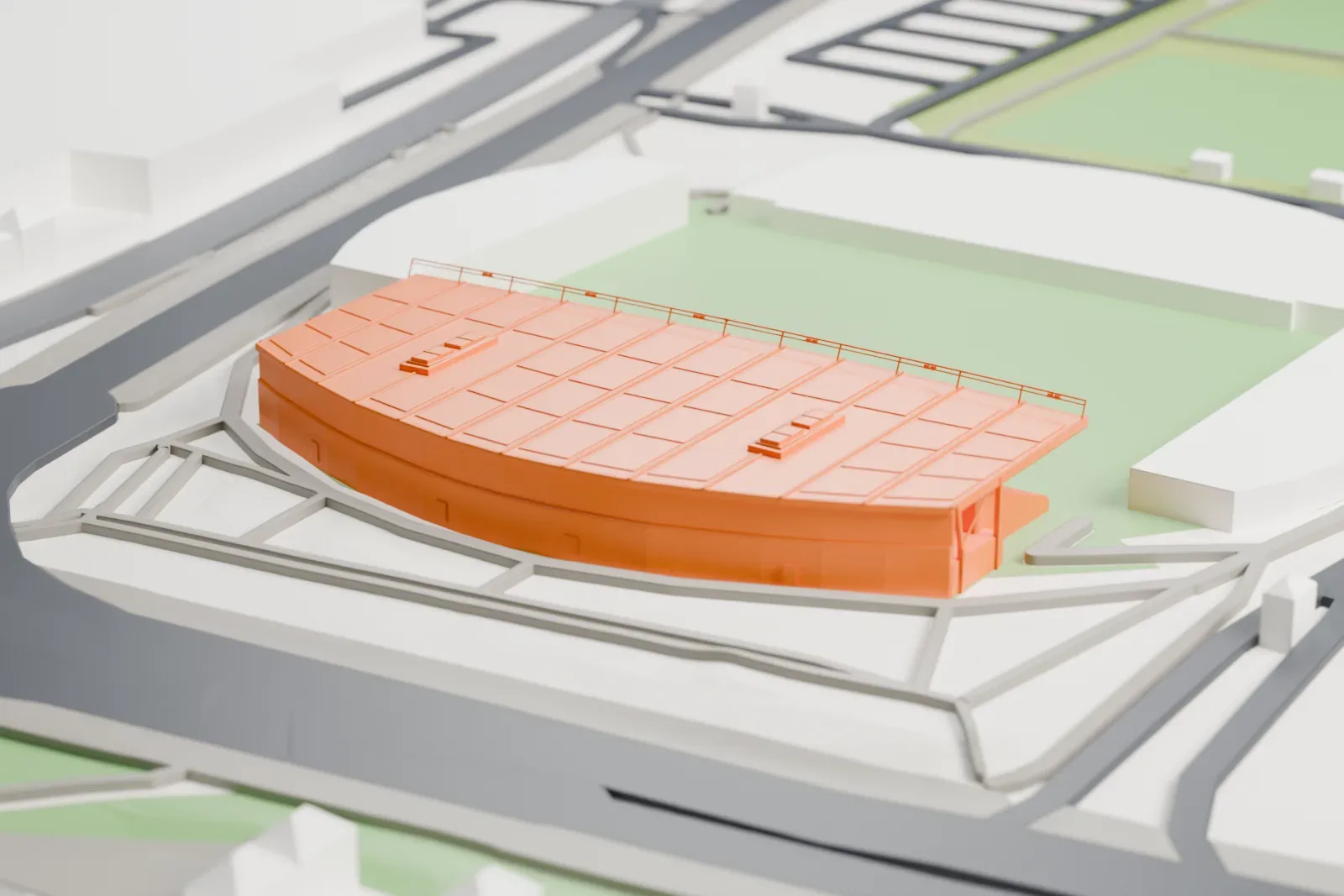 A white 3D print of the Academy Stadium's west stand, with its curved rear enclosure and cantilevered roof, among surrounding streets and buildings.