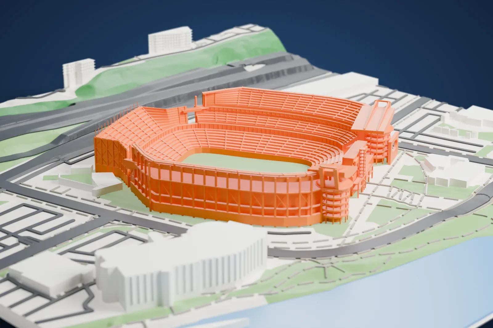 A white 3D print of Acrisure Stadium, with its open end, corner ramp towers and roofed grandstands, among city streets and buildings.
