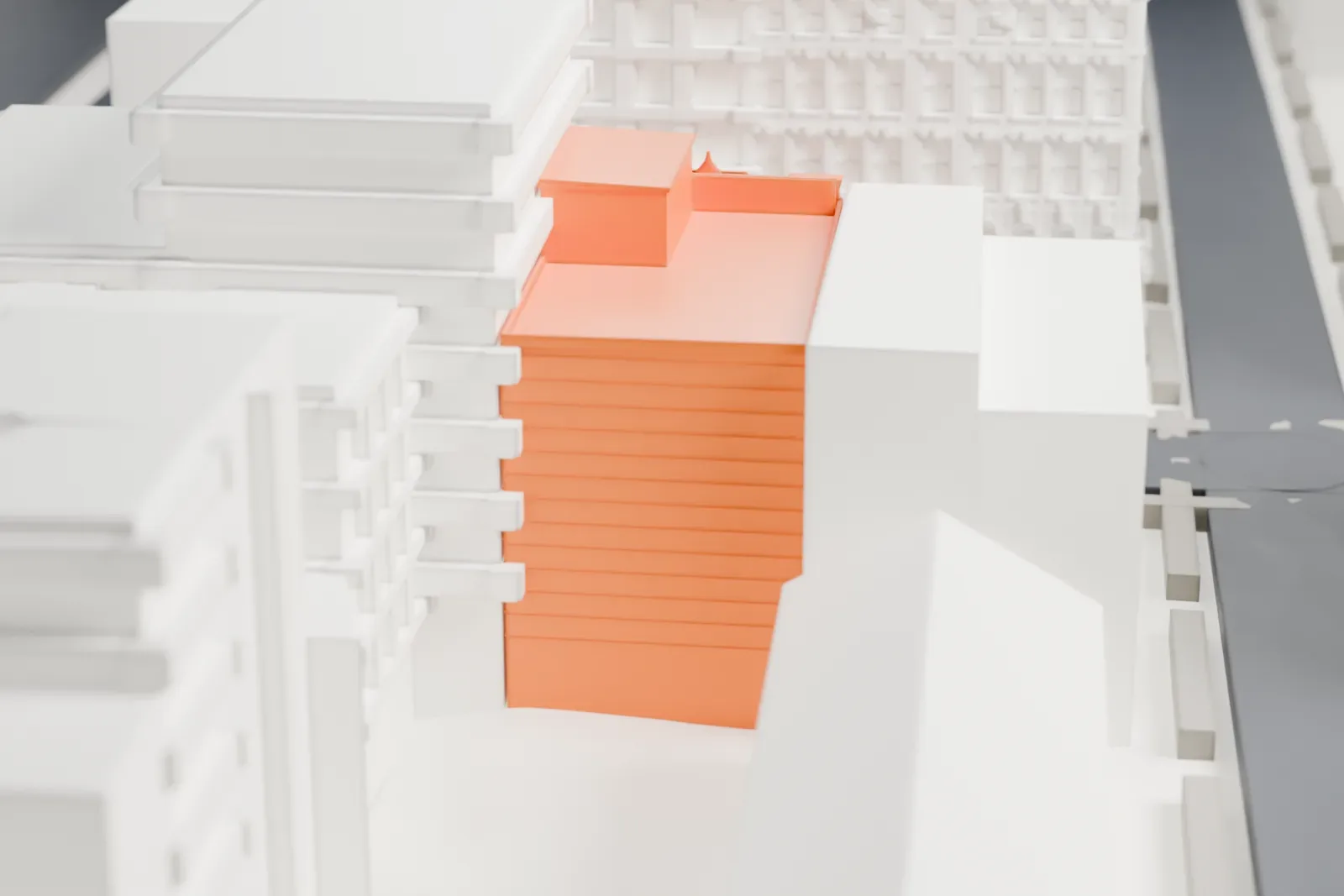 A white 3D print of the Adath Jeshurun of Jassy Synagogue, a small building among dense Lower East Side blocks, with green park space nearby.