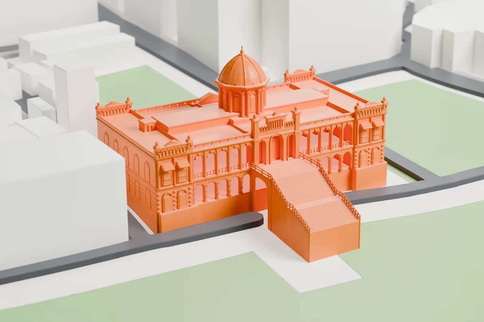 A white 3D print of Ahsan Manzil, a long palace with a central dome, standing on lawns with a river behind it and dense low buildings around it.
