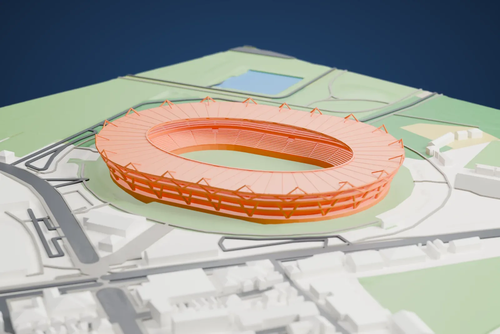 A white 3D print of Ajinomoto Stadium, a low bowl of seating with a roof rim above the upper level, set among the surrounding streets and buildings.
