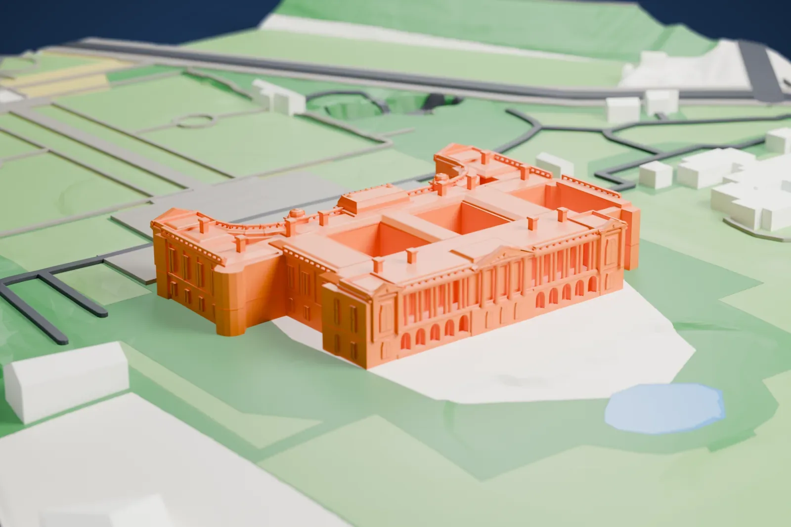 A white 3D print of the Akasaka Palace standing on its grounds in Tokyo, with the surrounding streets and buildings of the city.