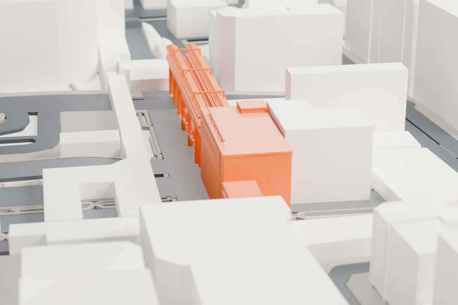 A white 3D print of Akihabara Station, a low station building among the surrounding city buildings.