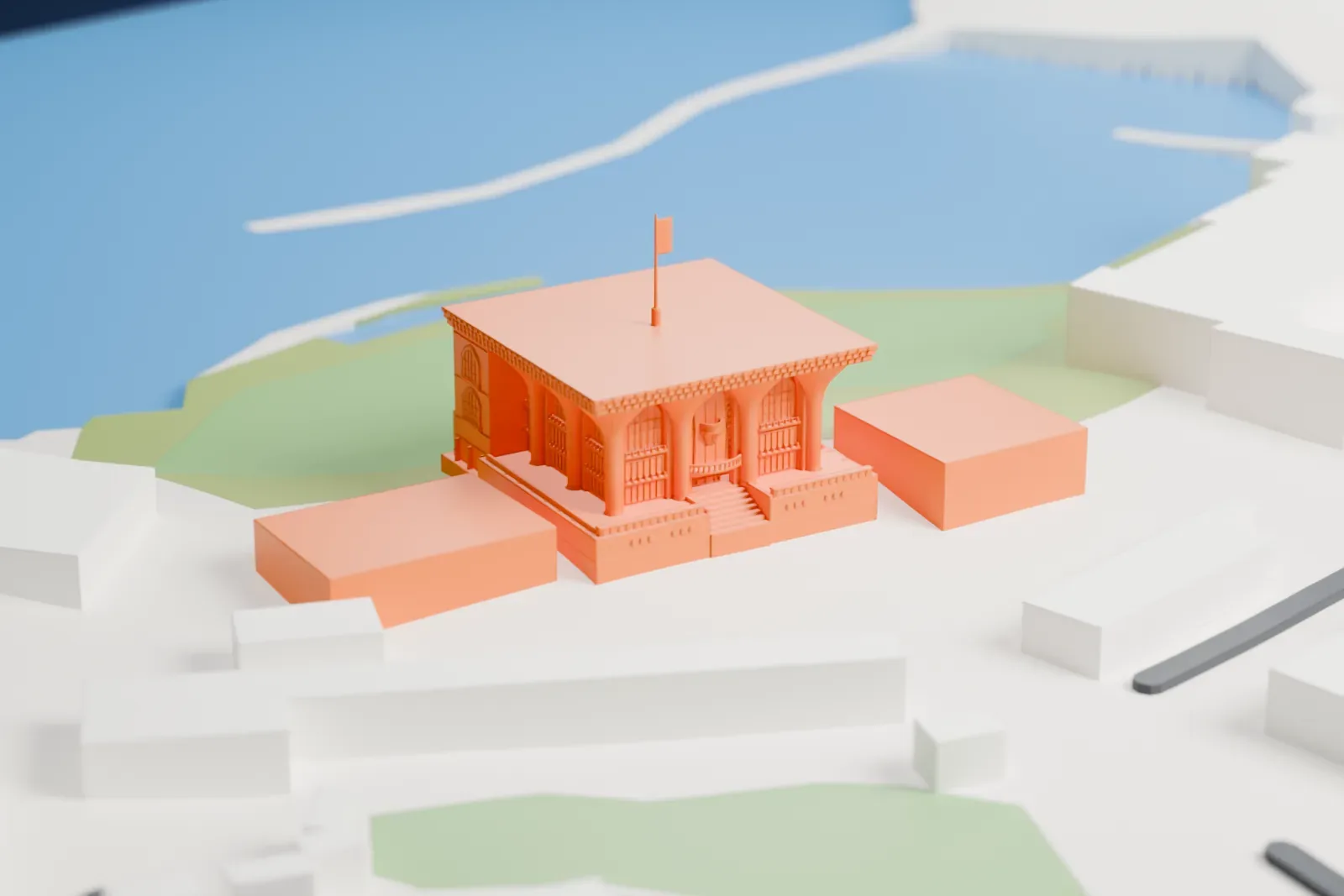 A white 3D print of Al Alam Palace, a flat-roofed building with arched windows, a columned front and a flagpole, beside green ground, low buildings and water.