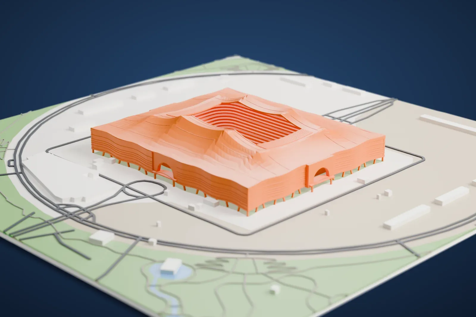 A white 3D print of Al Bayt Stadium, a tent-like stadium with peaked roof ridges, among the surrounding streets and buildings.