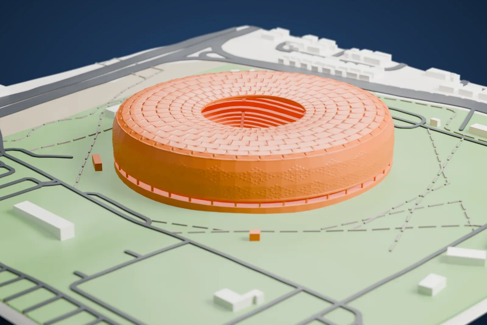 A white 3D print of Al Thumama Stadium, a round ring-shaped stadium with a patterned facade, standing in a green park crossed by roads and paths.