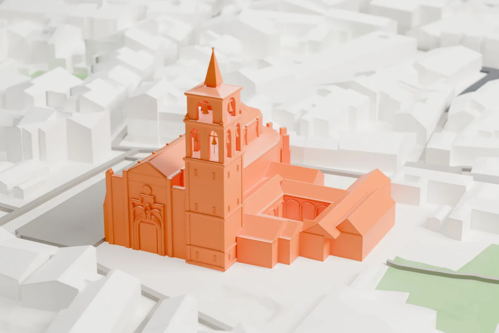 A white 3D print of the Alcalá de Henares Cathedral, standing among surrounding city buildings.