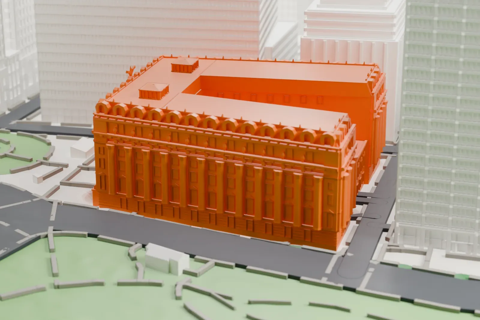 A white 3D print of the Alexander Hamilton U.S. Custom House, a large columned building with an ornate roofline beside a curved street and a green park, with taller buildings behind.
