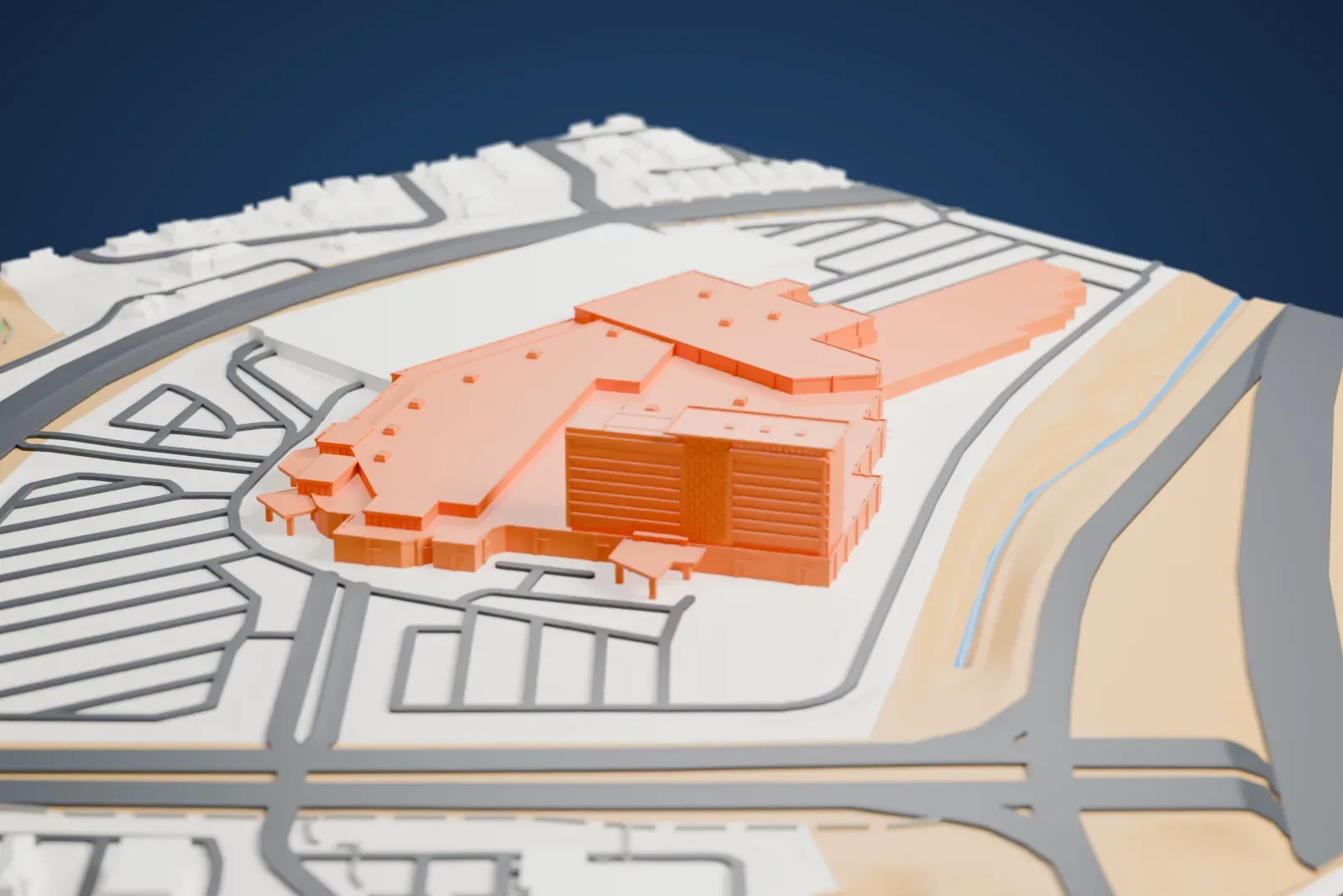 A white 3D print of Aliante Casino and Hotel, a wide low casino building with a taller hotel block at one end, surrounded by parking lots and roads.