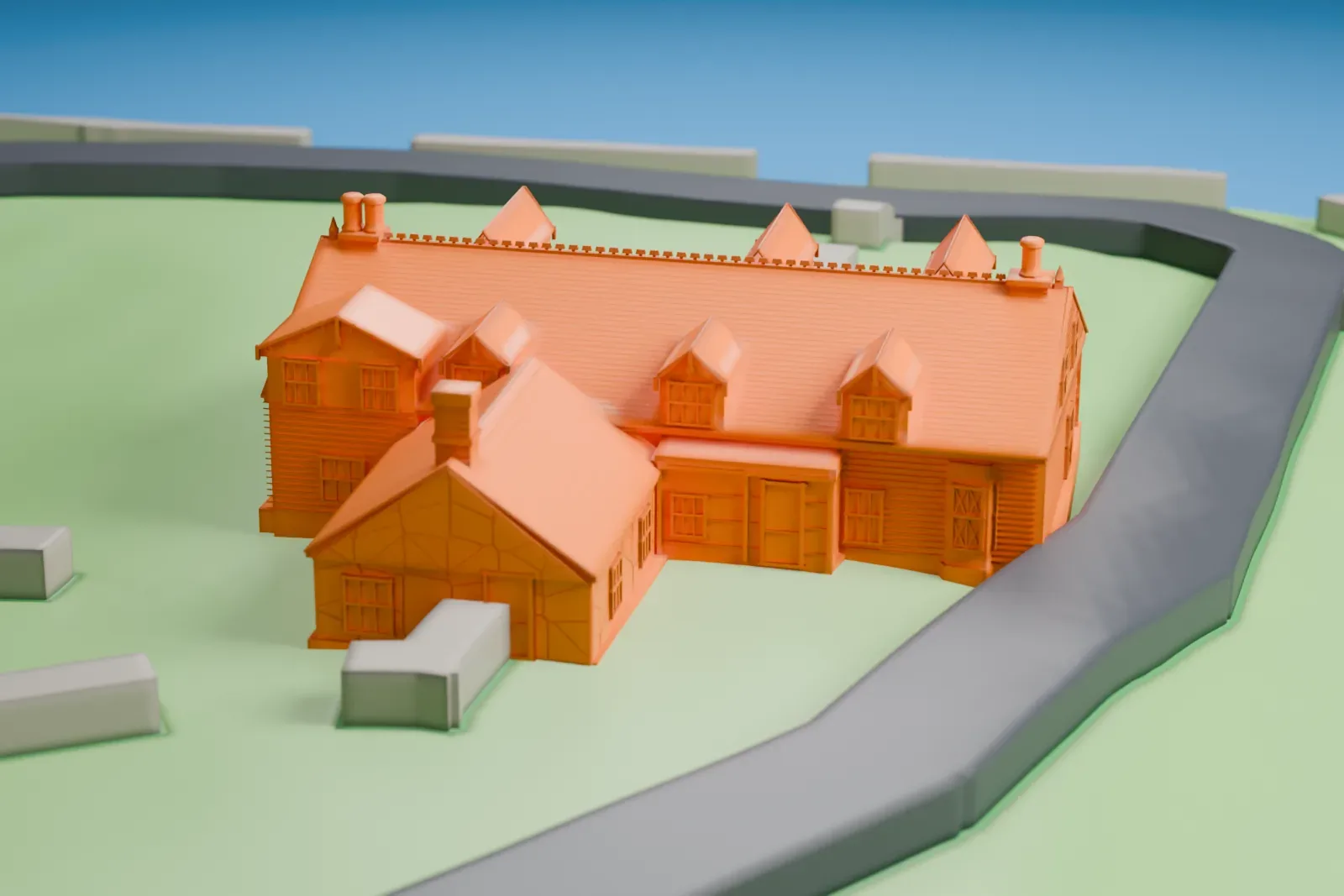 A white 3D print of the Alice Austen House, a small house with many gables and chimneys on a grassy hillside beside a curving drive, with the water of the harbor and nearby buildings around it.