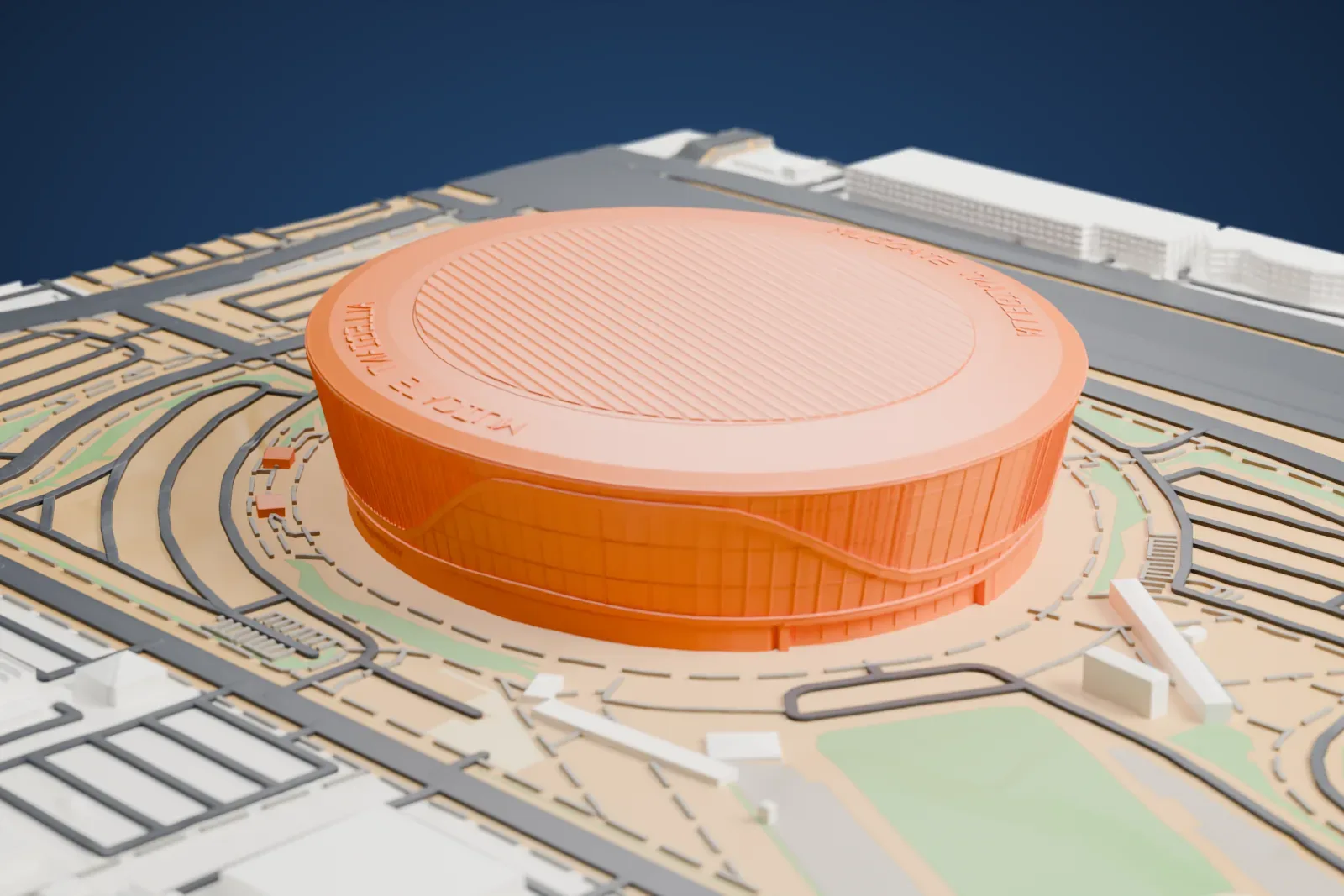 A white 3D print of Allegiant Stadium, a wide oval stadium with a ribbed flat roof, surrounded by curving roads, open lots and patches of green.